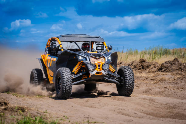 istock UTV buggy and 4x4 offroad in sandy track. Rally extreme riding 2152586346