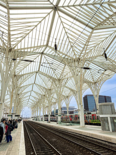 Lisbon Oriente Train and Bus Station where steel and glass trees interlock to form a continuous system of transparent roofs