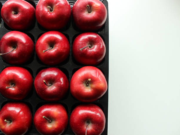 Perfect Juicy Red Apples In Separated Places Of Black Plastic Tray