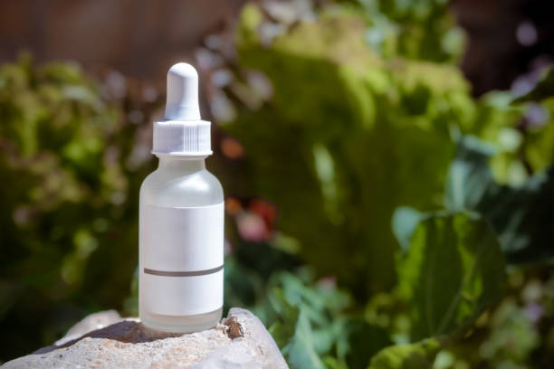 istock Glass dropper bottle on a nature environment with copy space 2152595458