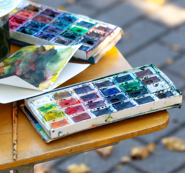 istock Artist's paints on a table in the park 2152597716