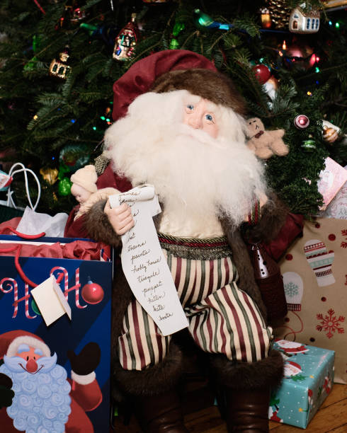 istock Santa Klaus doll under the Christmas tree 2152598101
