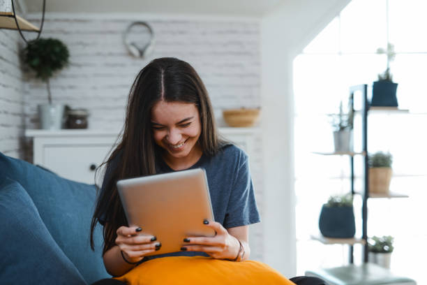 istock Smiling Female Happy About Investment Success While Using Digital Tablet Online 2152598329