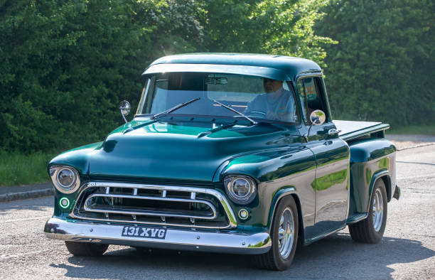 Stoke Goldington,UK - May 12th 2024: 1956 green Chevrolet Pick Up truck driving on a British road