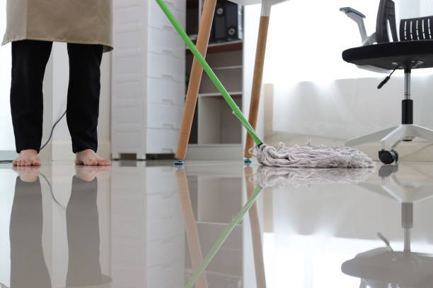 istock Housekeeper is mopping floors at home with a mop. 2152601313