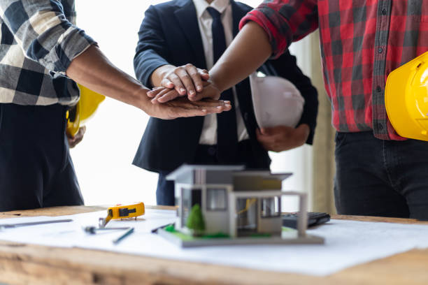 istock Collaborative teamwork of architect partners to design the development of a successful real estate construction project. 2152602079
