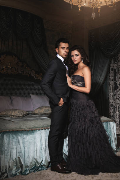 istock Elegant Couple stand confidently in a richly decorated bedroom 2152603039