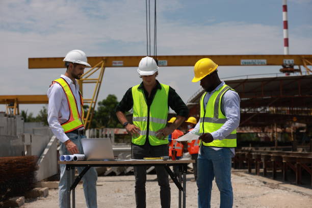 istock The project engineering team is currently working on the construction site and they are required to adhere to the progressive guidelines. 2152603836