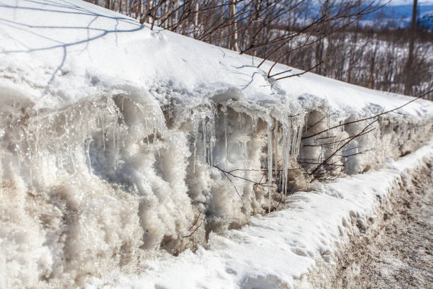 istock Hibiny, melting snow, spring sun, icicles, roads, Kirovsk 2152604248