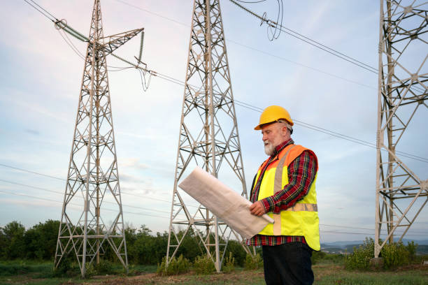 istock Electrician inspecting high-voltage towers 2152604950