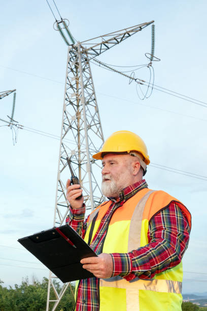istock Electrician inspecting high-voltage towers 2152604970