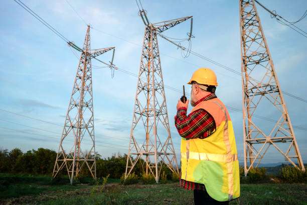 istock Electrician inspecting high-voltage towers 2152604981