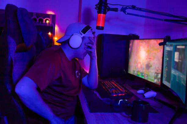 istock Young man looks lost while playing video game. Streamer and pro gamer lost the game. 2152607013