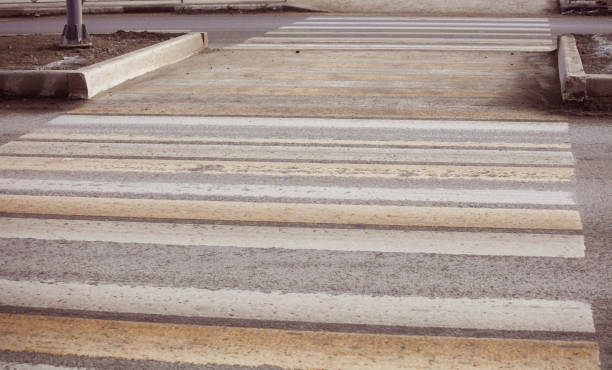 Pedestrian crossing on an asphalt road.