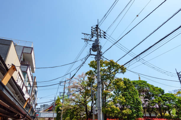 istock Electricity pole in Japan with power line cables against sky, Tokyo 2152607645