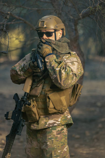istock airsoft soldier in the forest at sunset 2152610247