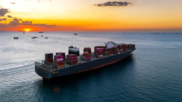 istock Top view Logistics and transportation of Container Cargo ship and Cargo plane with working crane bridge in shipyard at sunrise, logistic import export and transport industry background 2152613428
