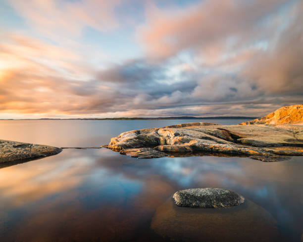 istock Rocky Shore With Water and Clouds 2152614109