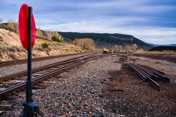 Freight train hauling coal passes through small town America.