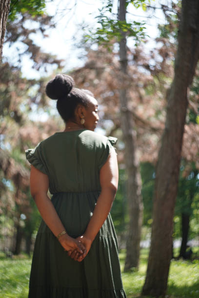 istock Black woman in the forest on a sunny day 2152621231