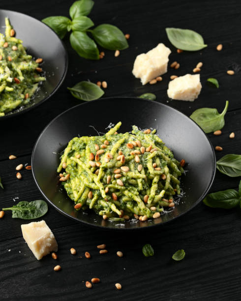 istock Trofie pasta with creamy spinach sauce and toasted pine nuts 2152621849
