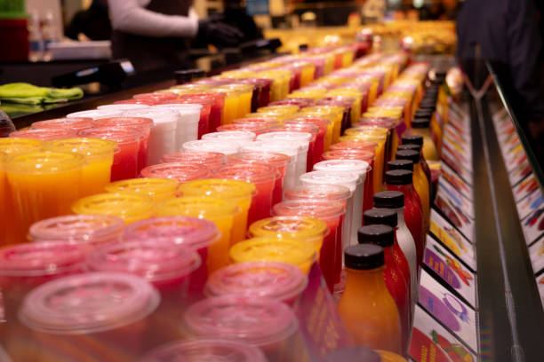 Fresh smoothies arranged on the iced marked stall.