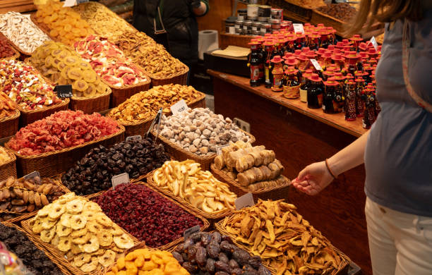 istock Woman choosing dried fruit on the market 2152625612