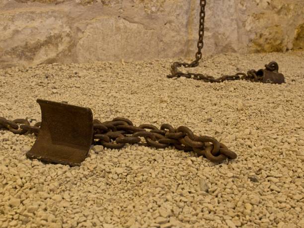 Iron shackles in cell at Fort Stockton Texas. The historic fort provided safe passage for mail and settlers during westward expansion after the Civil War. The fort was stationed by the 9th Calvary or Buffalo soldiers.