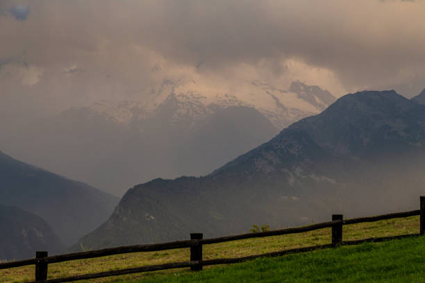 Summer sunset with a thunderstorm approaching in the mountains of Valle d'Aosta