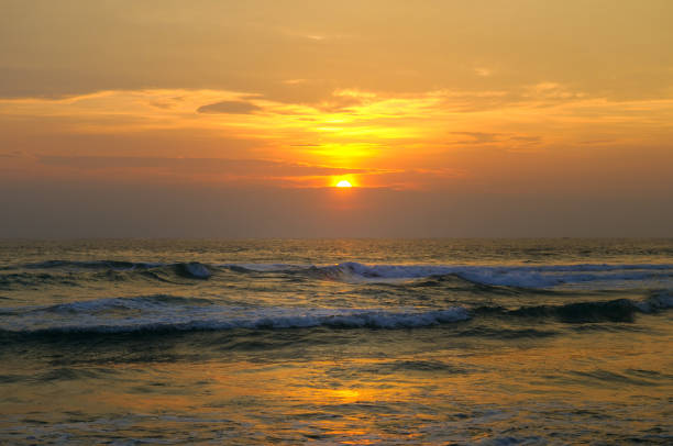 Panoramic beach landscape. Inspire tropical beach seascape horizon. Orange and golden sunset sky calmness tranquil relaxing sunlight summer mood.