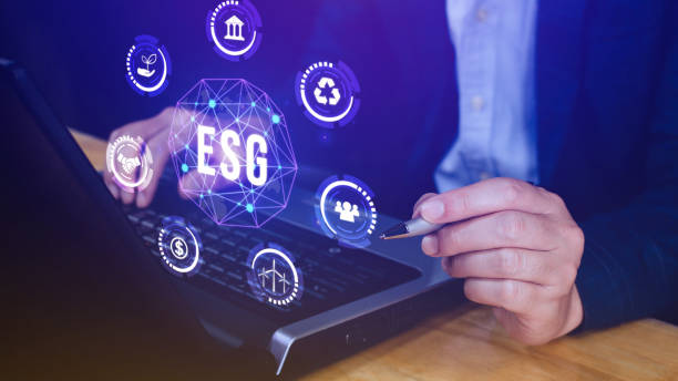 istock ESG icon concept use a computer to analyze ESG for environmental, social and governance in sustainable and ethical business on the Network connection, businessman pressing button on screen. 2152633991