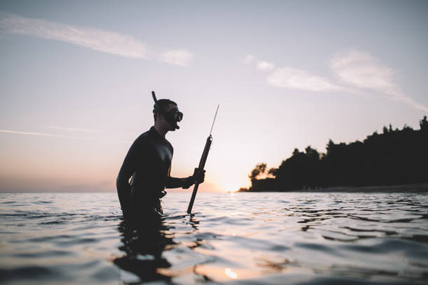 istock Spearfisherman getting out of the water 2152635886