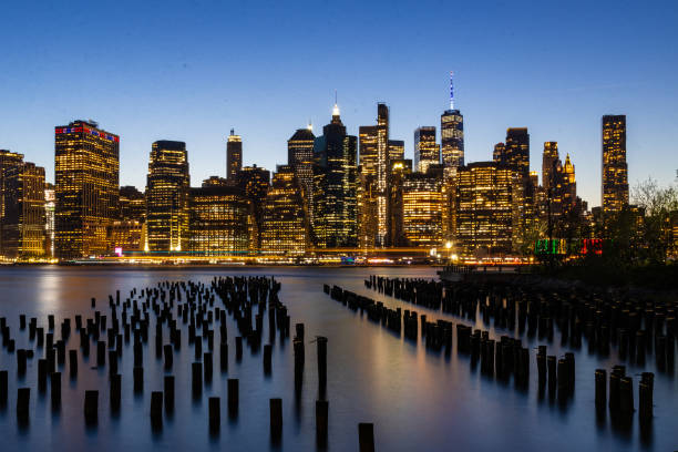 A bird's eye view of the New York City skyline during the day and at night. The city that never sleeps, with breathtaking architecture.