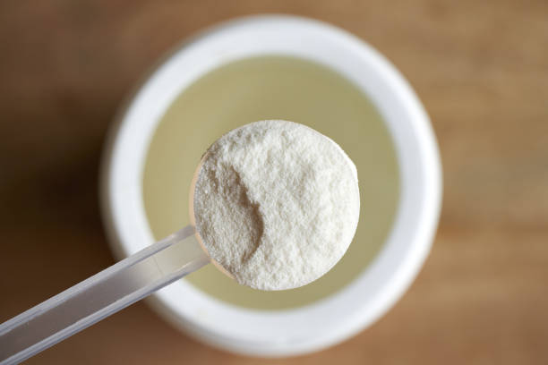 Collagen powder in a plastic measuring spoon