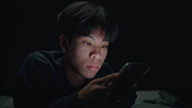 istock Teenager using smartphone at night. 2152639328