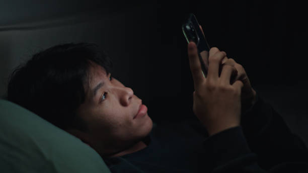 istock Teenager using smartphone at night. 2152639330