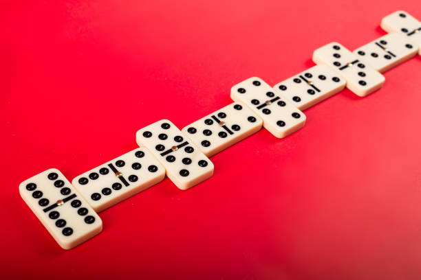 Dominoes on a red background. White Bones Board Game.