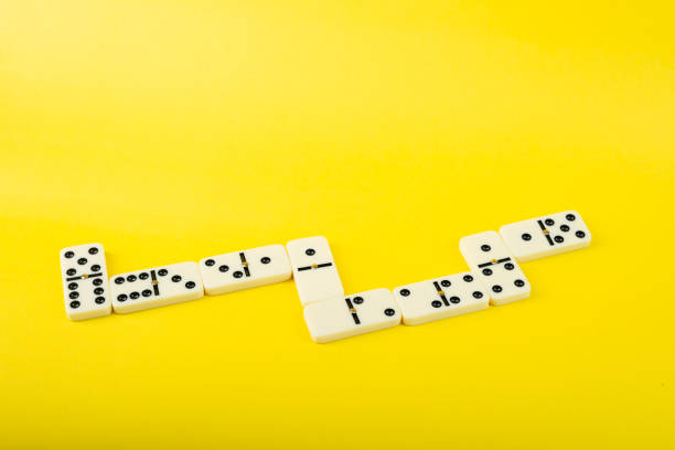istock Dominoes on a yellow background. 2152639962