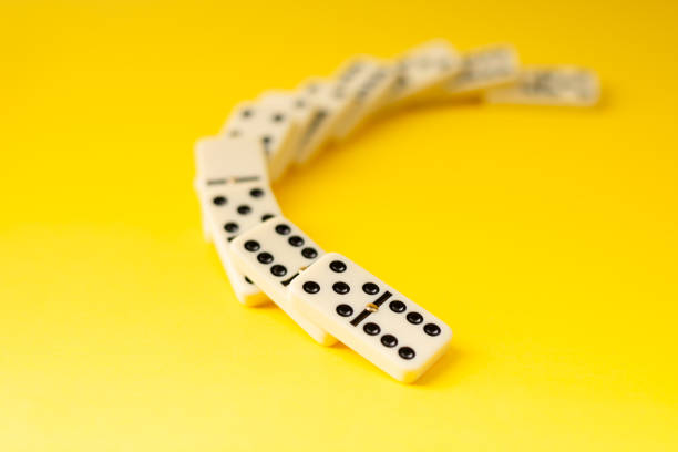 istock Dominoes on a yellow background. 2152639974