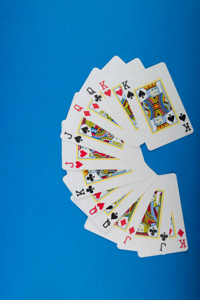 istock Playing cards isolated on blue background. 2152640019