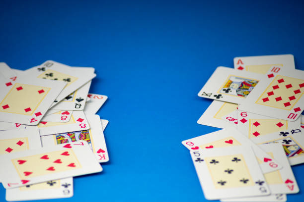 istock Playing cards isolated on blue background. 2152640024