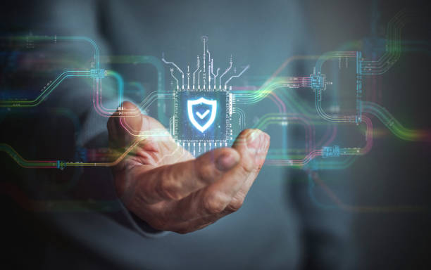 istock Security in your hand. A hand holds digital shield icon in the center and circuit board with vibrant data transfers, representing evolving security technology of the future. 2152640042