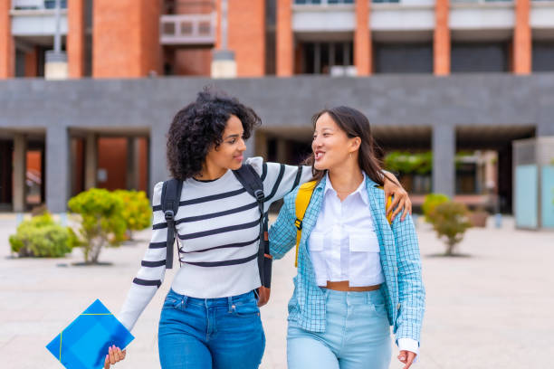 istock Multi-ethnic student embracing walking along the university campus 2152645321