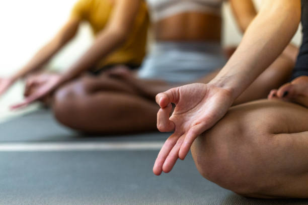 istock Serene yoga group in lotus position. 2152646527