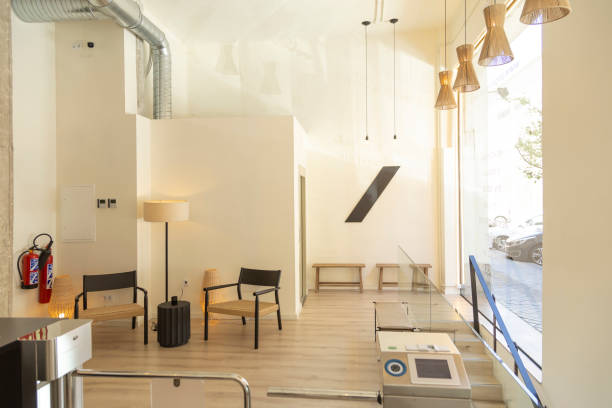 istock Bright yoga studio reception with hanging lights and street view. 2152646536