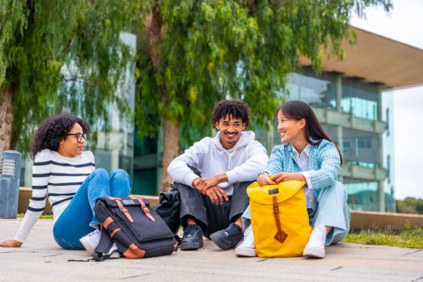 istock Cool diverse students sitting on the university campus chatting relaxed 2152646915