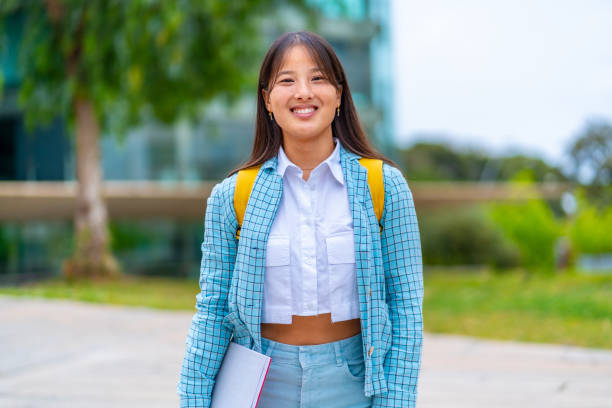 istock Smiling chinese university student standing in the campus 2152647035