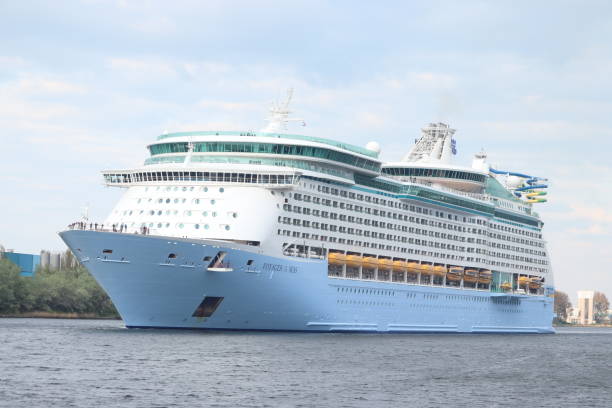 IJmuiden, The Netherlands - April 22nd, 2022: Voyager of the Seas, operated by Royal Caribbean International. Crossing North Sea canal towards Zeesluis IJmuiden