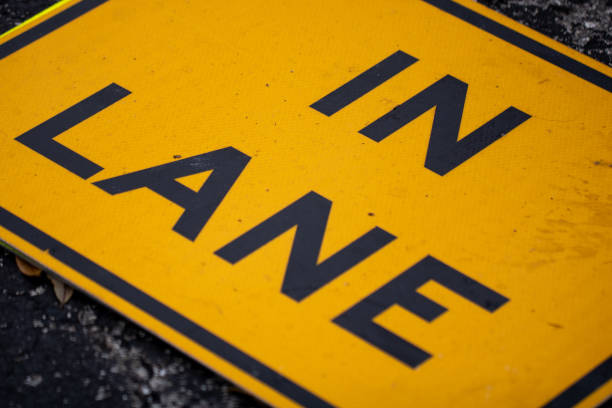 In Lane Road Sign on the ground