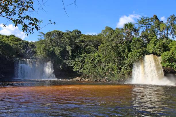 istock Waterfalls flowing down water in a lake 2152655212
